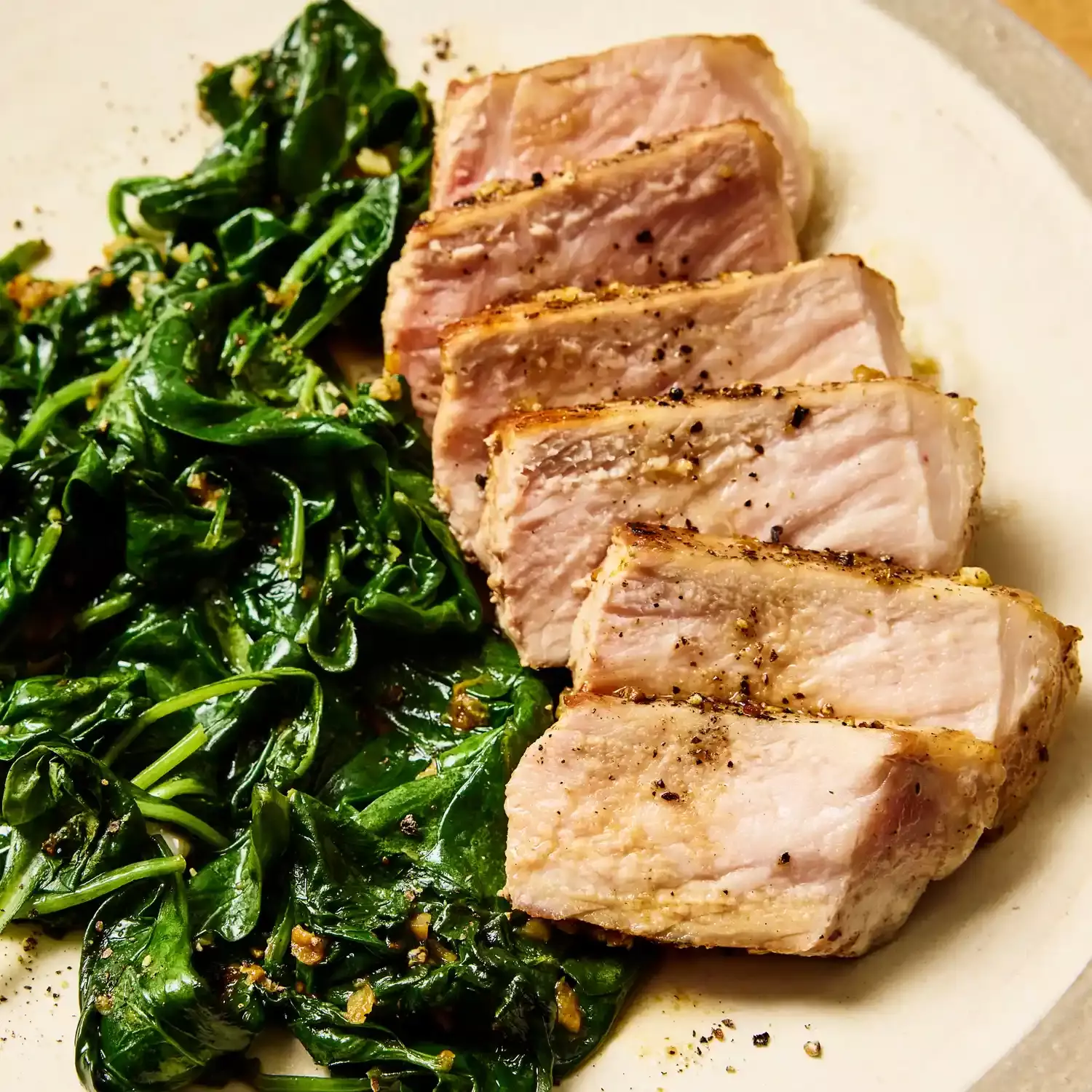 Quick One-Pan Garlic-Butter Pork Chops with Sautéed Spinach