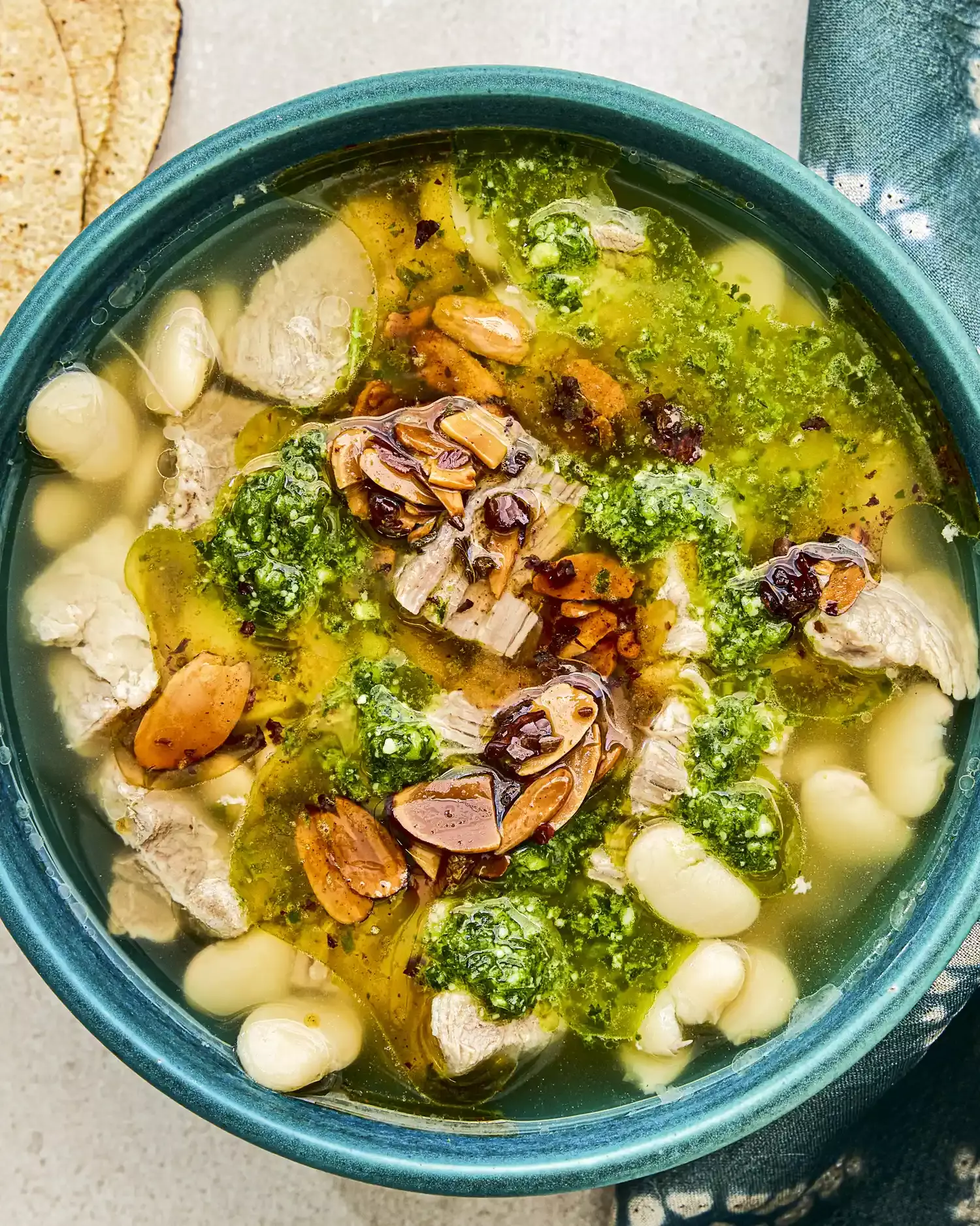 Mexican Brothy Beans with Pork, Salsa Macha, and Cilantro Pesto