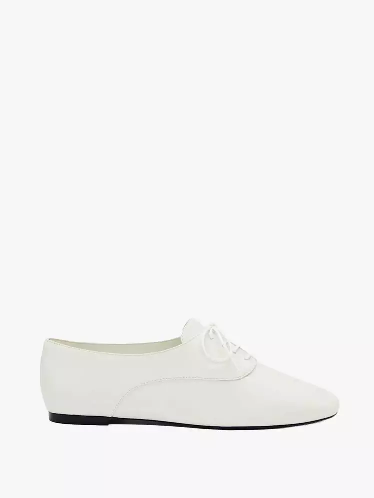 Lily Collins Embraces French-Girl Style with Classic Jazz Shoes