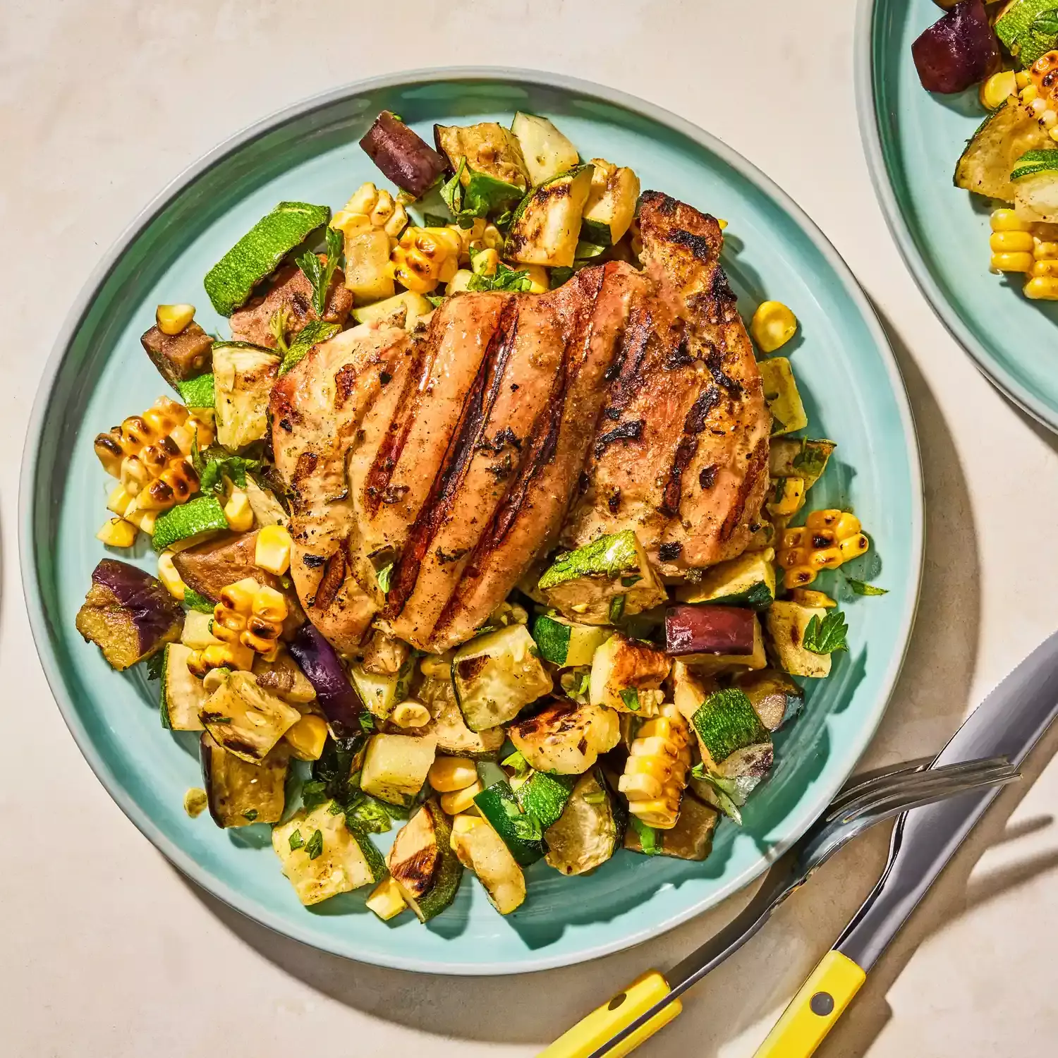 Flavorful Herb-Marinated Chicken Thighs with Grilled Vegetable Medley