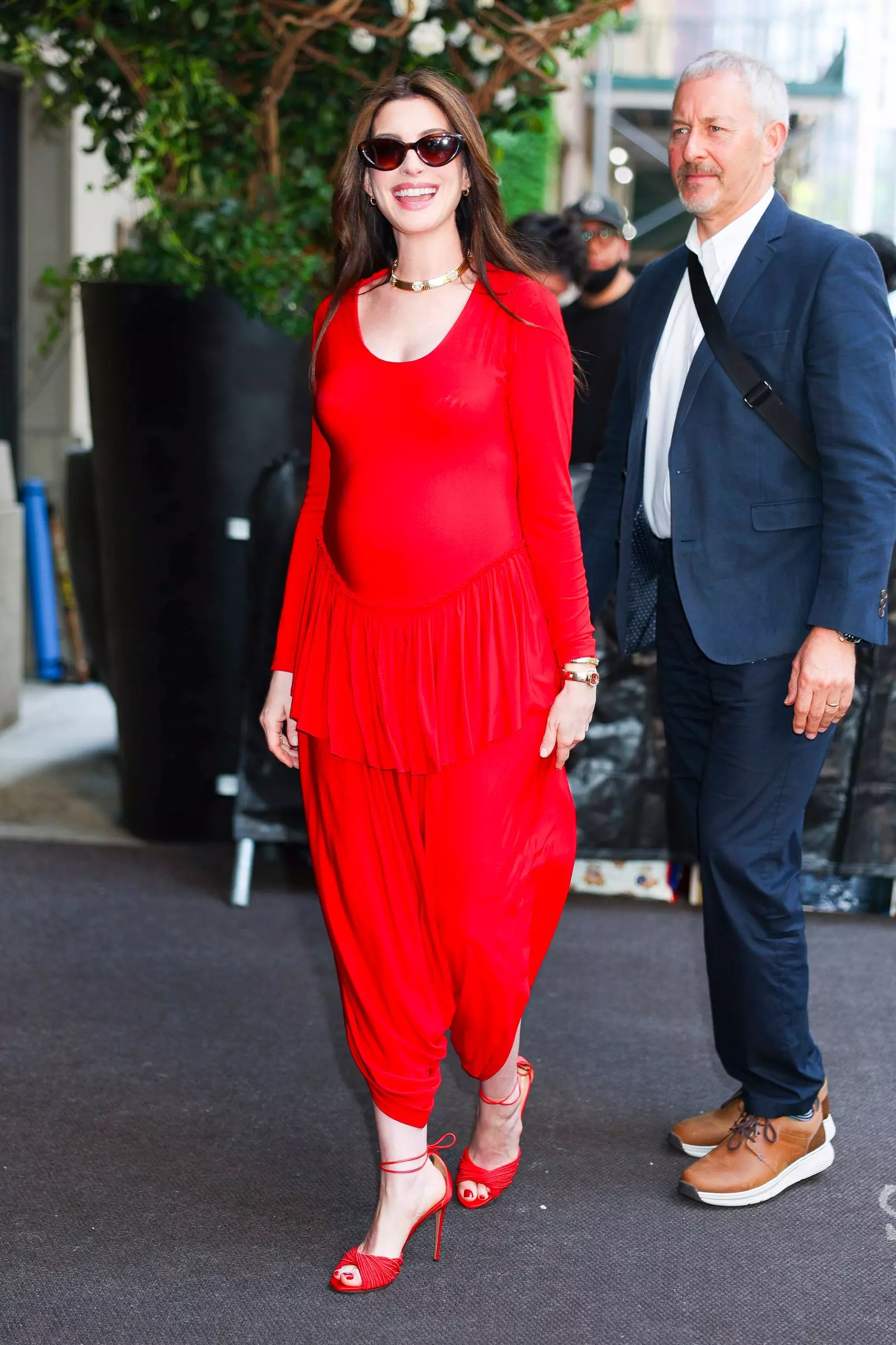 Anne Hathaway's Bold Maternity Style Debut in Red