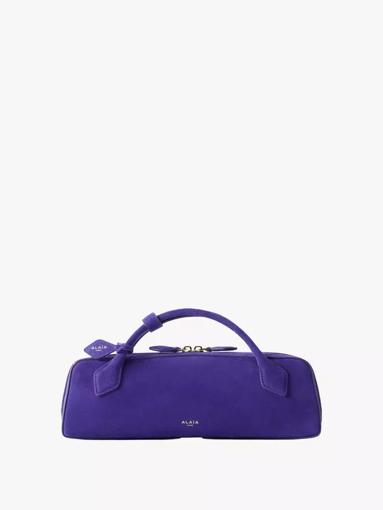 Fashion Week's Defining Trends: Purple Hues, Statement Brooches, and Inventive Styling
