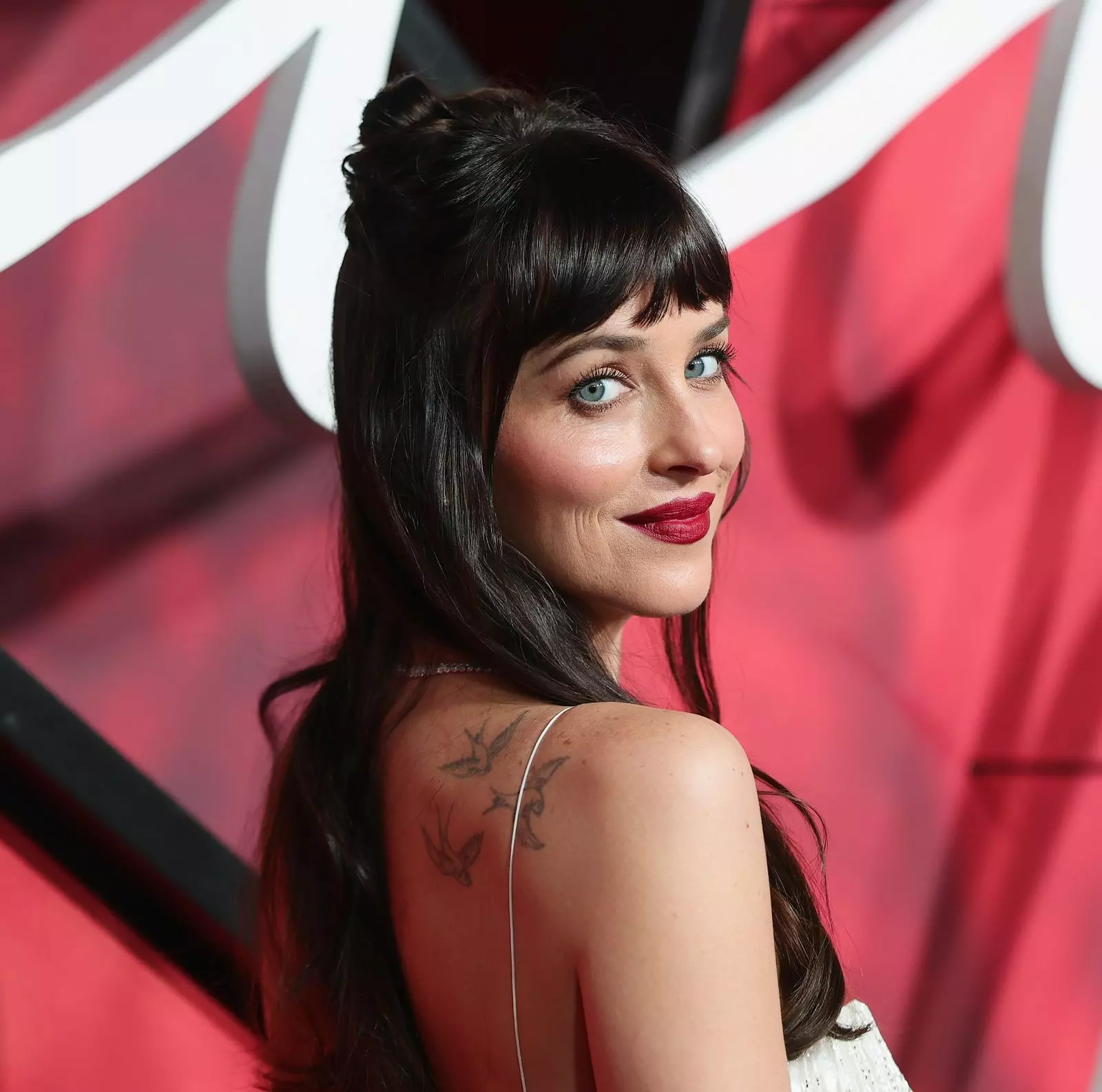 Dakota Johnson Revives Precision Red Lip at "Verity" Premiere