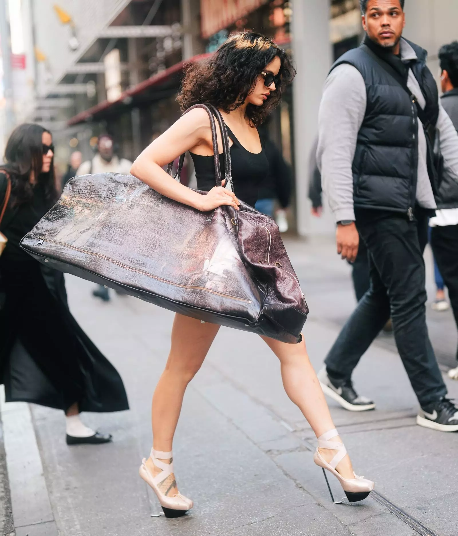 Rosalía's Bold Fashion Choices: Oversized Bags and Unique Ballet Platforms